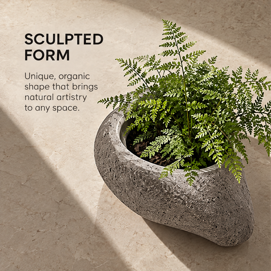 Sculpted Form – stone planter with fern on sunlit stone floor, unique organic shape that brings natural artistry to any space